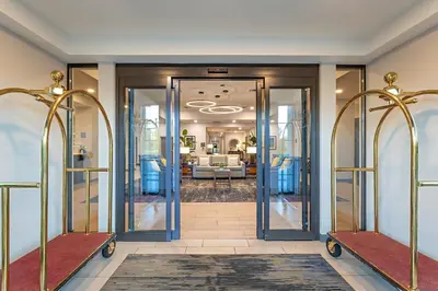 a hallway with glass doors leading to a living room at Pestana Orlando Suites - Lake Buena Vista in Orlando