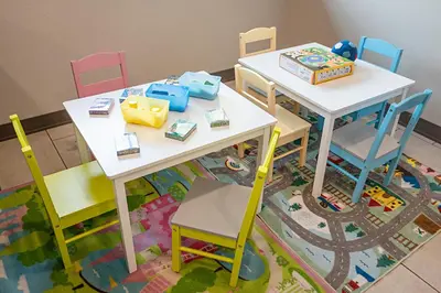 a classroom with two tables and chairs and a train table at Pestana Orlando Suites - Lake Buena Vista in Orlando