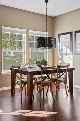 a dining room with a wooden table and chairs at Welcoming 4 BR Sleeps 10 Guests WL2901 in Kissimmee