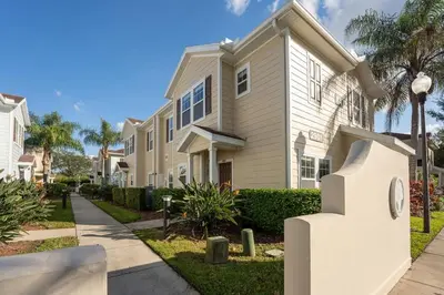 a house with a clock in front of it at Welcoming 4 BR Sleeps 10 Guests WL2901 in Kissimmee