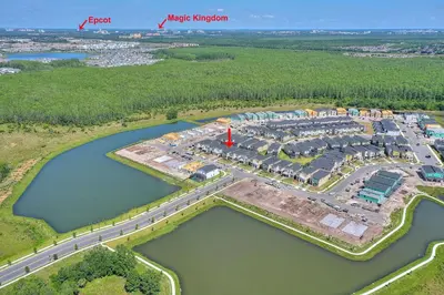 an aerial view of a resort next to a body of water at Stars Align Storey Lake by Shine Villas villa in Kissimmee