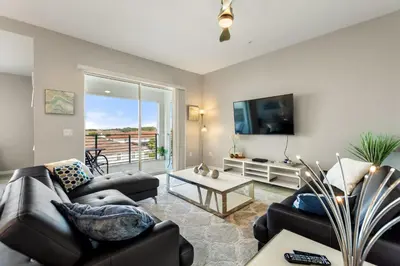 a living room with two couches and a tv at Fireworks Night -Storey Lake by Shine Villas 709 apts in Kissimmee