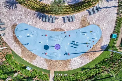 an overhead view of a swimming pool with people in it at Fireworks Night -Storey Lake by Shine Villas 709 apts in Kissimmee