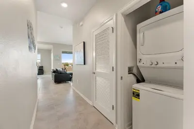 a laundry room with a washer and dryer in a house at Fireworks Night -Storey Lake by Shine Villas 709 apts in Kissimmee