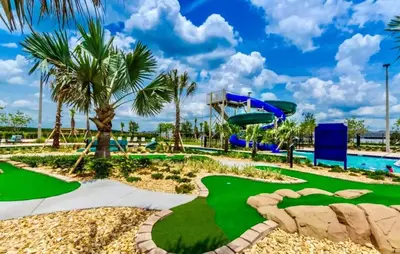 a miniature golf course at a resort with a slide at Vacation Meadows - Storey Lake by Shine Villas 710 apts in Kissimmee