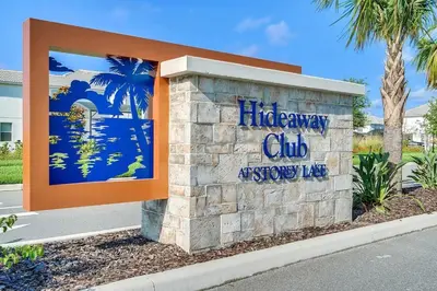 a sign for a life away club accessory king at Barefoot Breeze - Storey Lake by Shine Villas #833 townhouse in Kissimmee