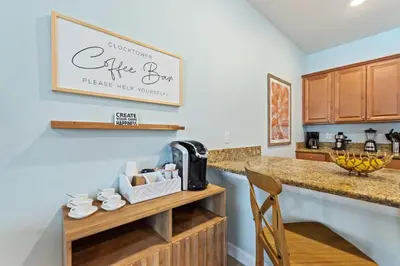 a kitchen with a counter with a coffee maker on it at Haven Station at Storey Lake by Shine Villas townhouse in Kissimmee
