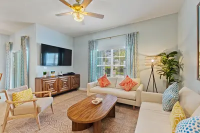 a living room with a couch and a table at Haven Station at Storey Lake by Shine Villas townhouse in Kissimmee