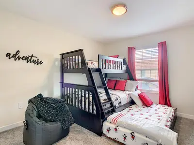 a bedroom with a bed and a bunk bed at Happy Haven at Storey Lake Resort by Shine Villas condo in Kissimmee