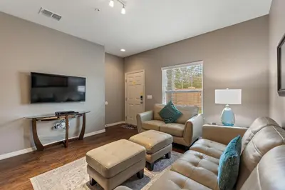 a living room with a couch and a tv at Lucky Find Lucaya Resort by Shine Villas #713 townhouse in Kissimmee