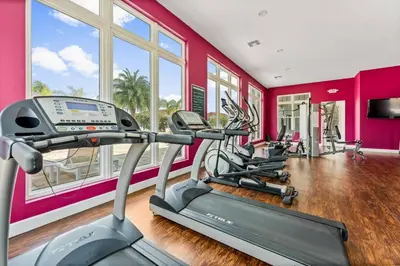 a gym with a row of exercise bikes in a room at Lucky Find Lucaya Resort by Shine Villas #713 townhouse in Kissimmee