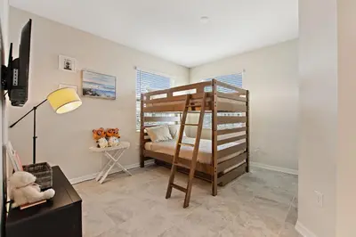 a bedroom with a bunk bed in a room at Triple Header Storey Lake by Shine Villas apts in Kissimmee