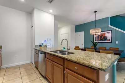 a kitchen with a sink and a counter top at Lazy Life at Storey Lake by Shine Villas #901 condo in Kissimmee