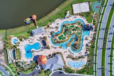 an aerial view of a large pool at a resort at Tranquility at Storey Lake by Shine Villas #828 apts in Kissimmee