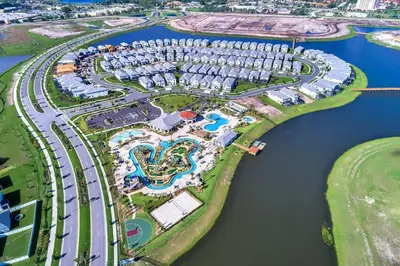 an aerial view of a resort complex next to the water at Tranquility at Storey Lake by Shine Villas #828 apts in Kissimmee