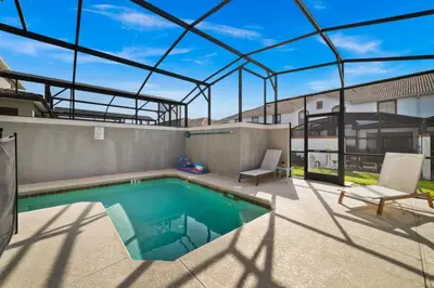 a swimming pool in a house with a glass ceiling at Star Hideaway at Storey Lake by Shine Villas townhouse in Kissimmee