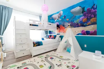 a childs room with a bed and an underwater theme at Beautiful Orlando Apt with Nemo Bedroom, 15 min to Disney! in Kissimmee