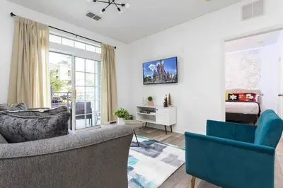 a living room with two couches and a bedroom at Your Orlando stay 15 min to Disney - DVH01 in Kissimmee