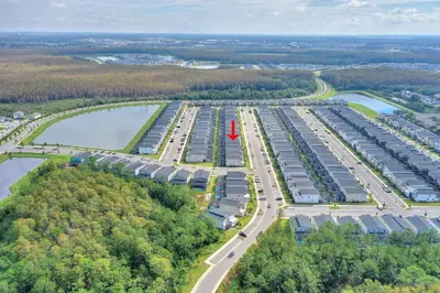 an aerial view of a parking lot with a red spot at Treat Retreat Storey Lake by Shine Villas #418 villa in Kissimmee