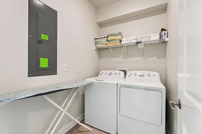 a laundry room with a washer and dryer at Treat Retreat Storey Lake by Shine Villas #418 villa in Kissimmee