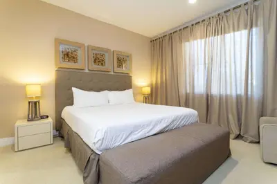 a bedroom with a large white bed and a window at Gorgeous 4 Bd Close to Disney @ Magic Village 3114 in Orlando