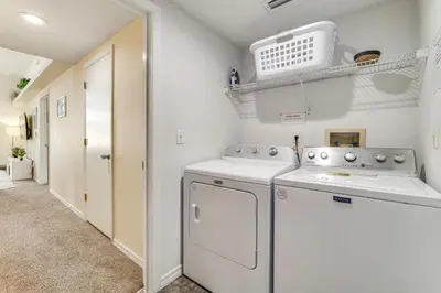 a laundry room with a washer and dryer at Pool and Hot Tub Home 17 Mi to Epic Universe! in Kissimmee