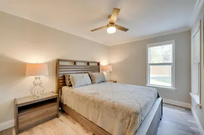 a bedroom with a bed and a ceiling fan at Apopka Home with Yard and Grill Near Wekiwa Springs! in Apopka
