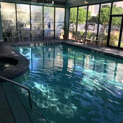 a swimming pool with blue water in a building at 3407 Luxury option for your visit in Orlando