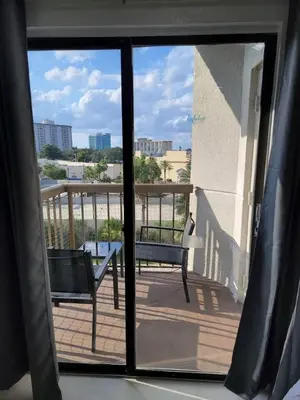 a view from a window of a balcony with a bench at 3509 Luxury Location and Location in Orlando
