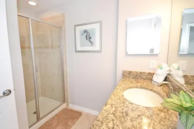 a bathroom with a sink and a shower at Majestic Retreat townhouse in Kissimmee