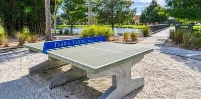 a ping pong table with a tennis court on it at Villa Azul townhouse in Kissimmee