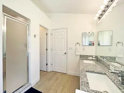a bathroom with two sinks and a large mirror at Sunshine Villa villa in Kissimmee