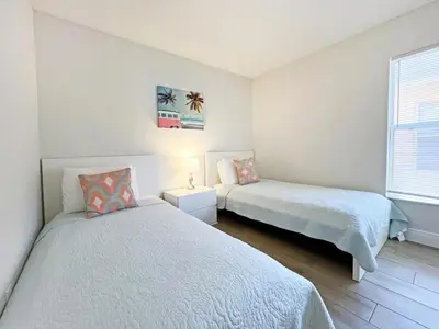 a bedroom with two beds and a window at Sunshine Villa villa in Kissimmee