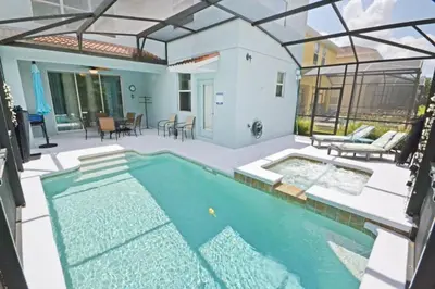 a swimming pool in the middle of a yard at Bamboo Palm home in Kissimmee