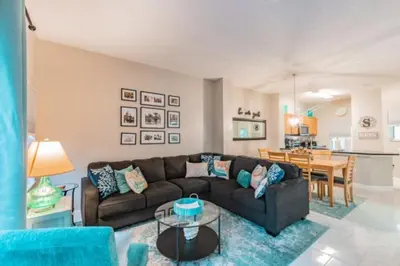 a living room with a couch and a table at Pompano Place townhouse in Kissimmee