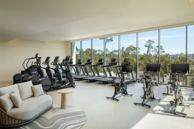 a gym with treadmills and elliptical machines at Conrad Orlando in Orlando