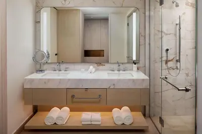 a bathroom with a sink and a shower at Conrad Orlando in Orlando