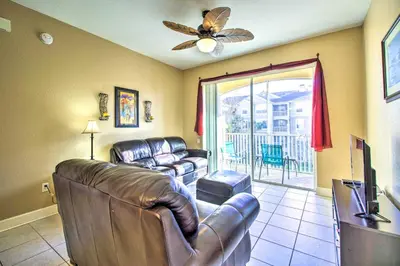 a living room with leather furniture and a ceiling fan at Resort Condo in Kissimmee about 3 Mi to Disney! in Orlando