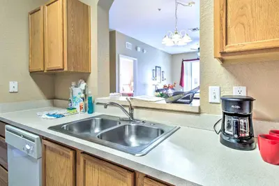 a kitchen with a sink and a counter top at Resort Condo in Kissimmee about 3 Mi to Disney! in Orlando