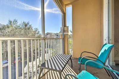 a balcony with a table and chairs on a balcony at Resort Condo in Kissimmee about 3 Mi to Disney! in Orlando