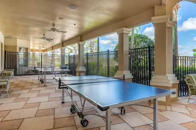 a room with two ping pong tables on a balcony at Resort Condo in Kissimmee about 3 Mi to Disney! in Orlando