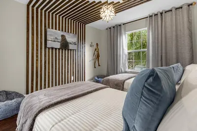 a bedroom with two beds and a window at Hidden gem! Gorgeous villa next to Disney in Kissimmee