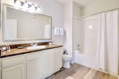 a bathroom with a sink and a toilet and a shower at 3BR Condo with Pool - Near Disney in Orlando