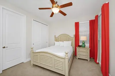 a bedroom with a bed and a ceiling fan at Inviting Home Near Disney With Private Pool And Waterpark & Resort Access At Encore Resorts Reunion - 7578Mr in Kissimmee