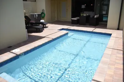 a large blue swimming pool in a house at Gorgeous 4Bd TH Pool Windsor at Westside-2018WW home in Orlando