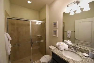 a bathroom with a shower and a sink at Gorgeous 4Bd TH Pool Windsor at Westside-2018WW home in Orlando