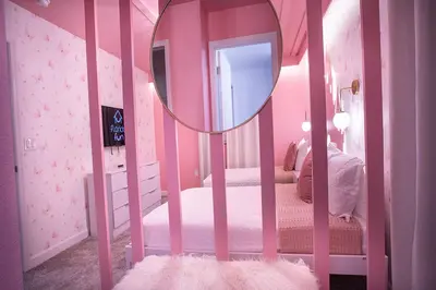 a room with a pink crib with a mirror at New Home 8 Bedrooms and 5 Bathrooms At Storey Lake in Kissimmee