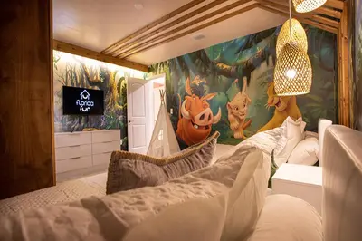 a bedroom with a halloween mural on the wall at New Home 8 Bedrooms and 5 Bathrooms At Storey Lake in Kissimmee