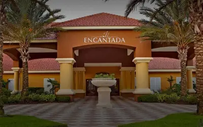 a resort building with a fountain in front of it at Amazing 3 Bdrm At Encantada- 6 miles from Disney in Kissimmee