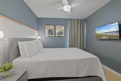 a bedroom with a bed and a ceiling fan at Amazing 3Bdrms At Encantada -6 miles from Disney in Kissimmee